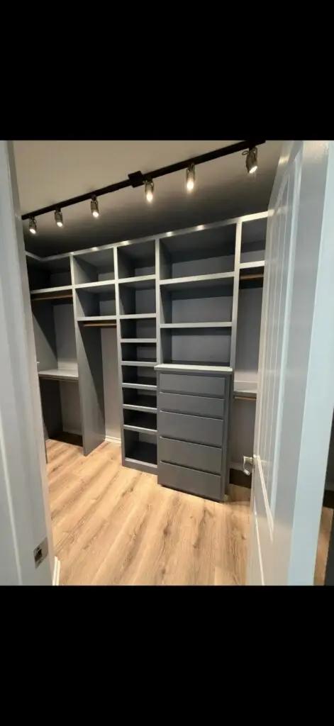 Custom walk-in closet with built-in shelving, drawers and track lighting, DFW home remodel
